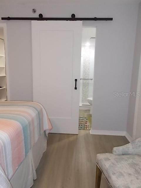 14001 Gulf Boulevard, Unit 407 Madeira Beach, FL 33708 - Photo 19 of 39 a bedroom with a bed and a window