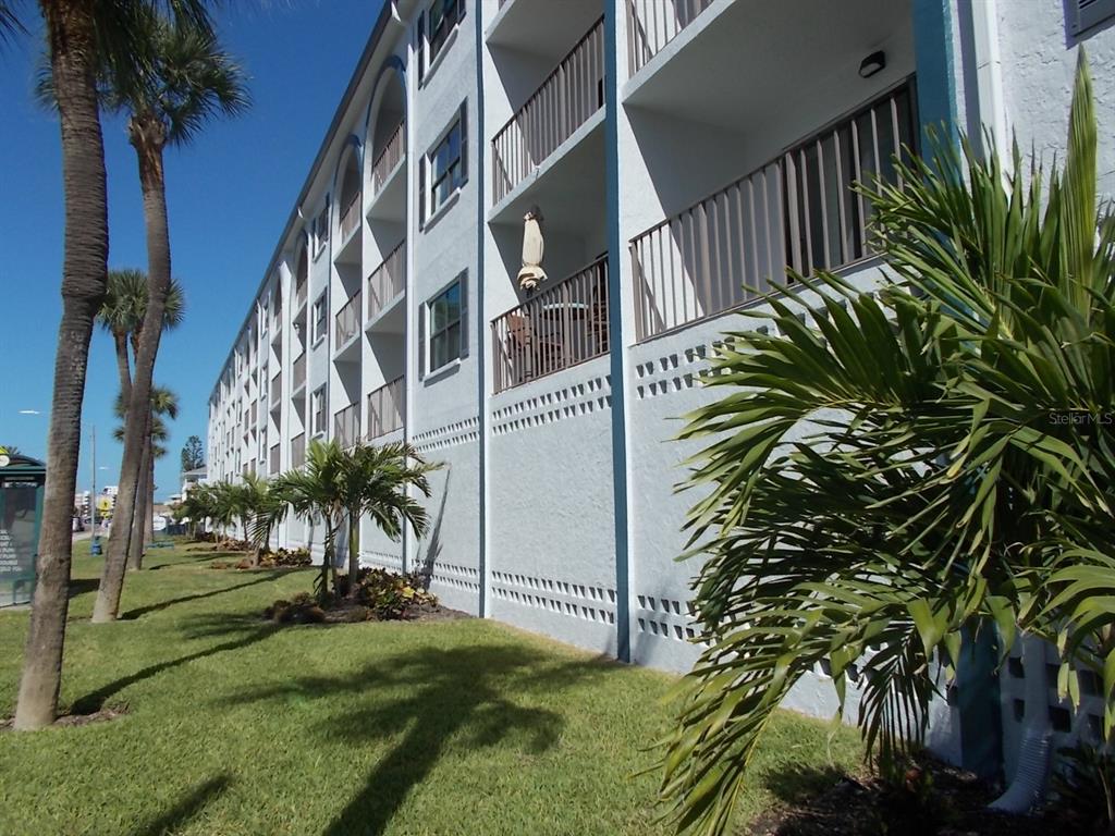 14001 Gulf Boulevard, Unit 407 Madeira Beach, FL 33708 - Photo 2 of 39 a view of balcony with garden and plants