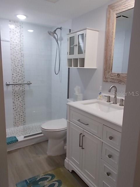 14001 Gulf Boulevard, Unit 407 Madeira Beach, FL 33708 - Photo 21 of 39 a bathroom with a sink a toilet and shower