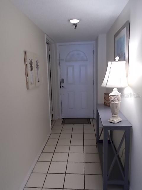14001 Gulf Boulevard, Unit 407 Madeira Beach, FL 33708 - Photo 28 of 39 a view of kitchen with furniture and wooden floor