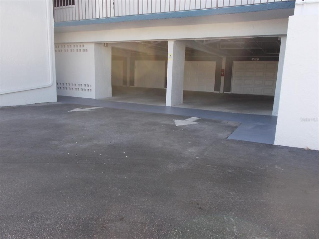 14001 Gulf Boulevard, Unit 407 Madeira Beach, FL 33708 - Photo 31 of 39 an empty room with a fireplace