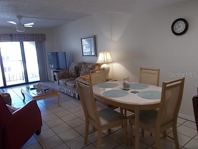 14001 Gulf Boulevard, Unit 407 Madeira Beach, FL 33708 - Photo 8 of 39 a view of a livingroom with furniture and window