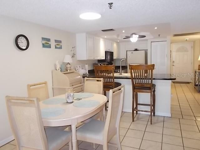 14001 Gulf Boulevard, Unit 407 Madeira Beach, FL 33708 - Photo 9 of 39 a view of kitchen with breakfast area