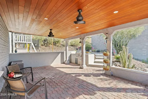 a front view of house with yard outdoor seating and barbeque oven