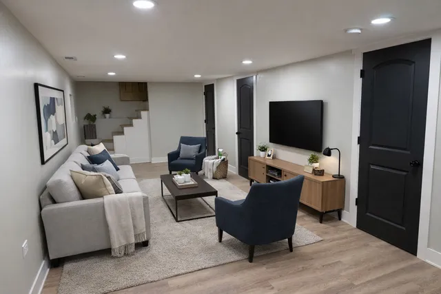 a living room with furniture and a flat screen tv