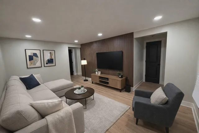 a living room with furniture and a flat screen tv