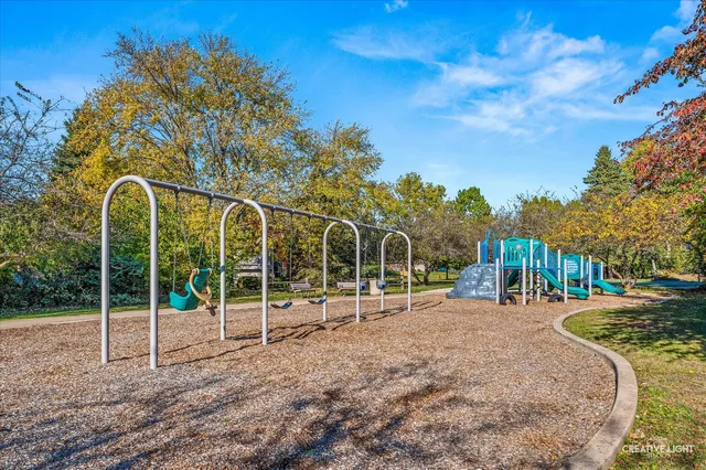 a childrens park with lots of trees