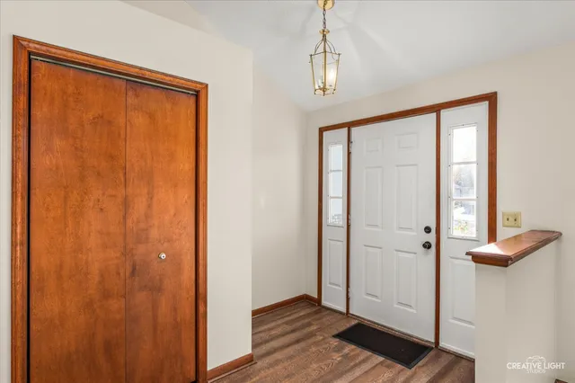 a view of front door with wooden floor