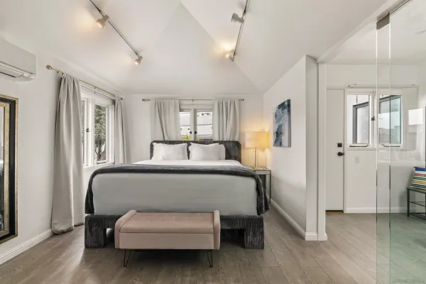 a bedroom with furniture and a window