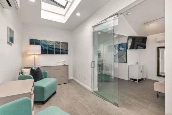 a en suite bathroom with a tub a mirror and a shower