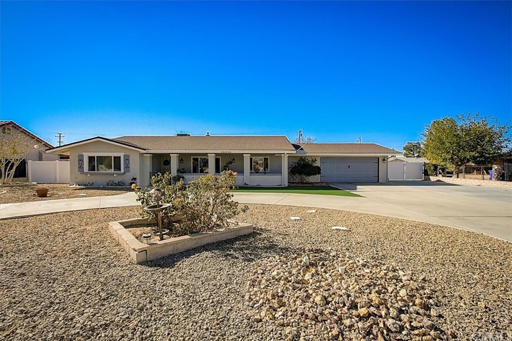 14334 Bochee Road Apple Valley, CA 92307 - Photo 1 of 1 a front view of a house with a yard