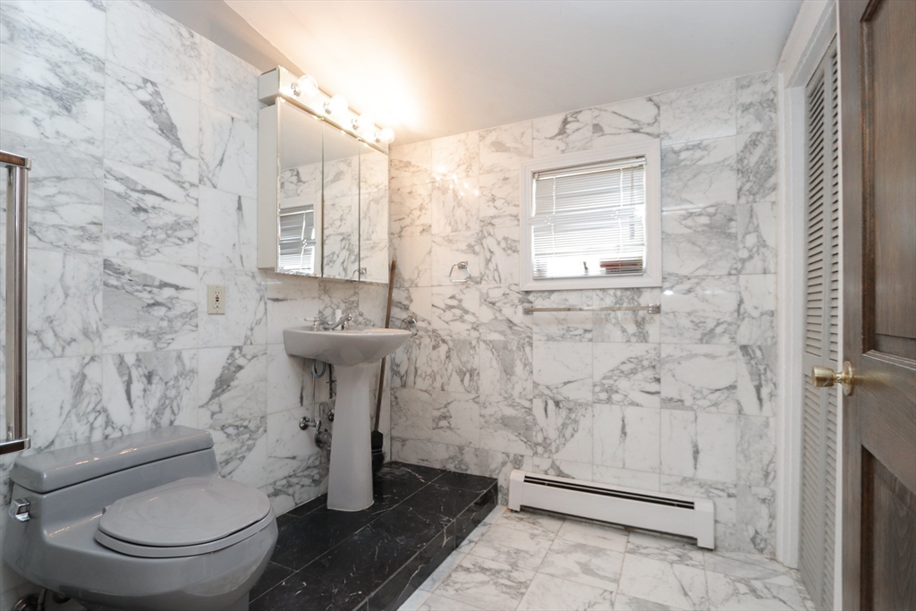 267 Winton Street Springfield, MA 01118 - Photo 20 of 28 a bathroom with a toilet sink and shower