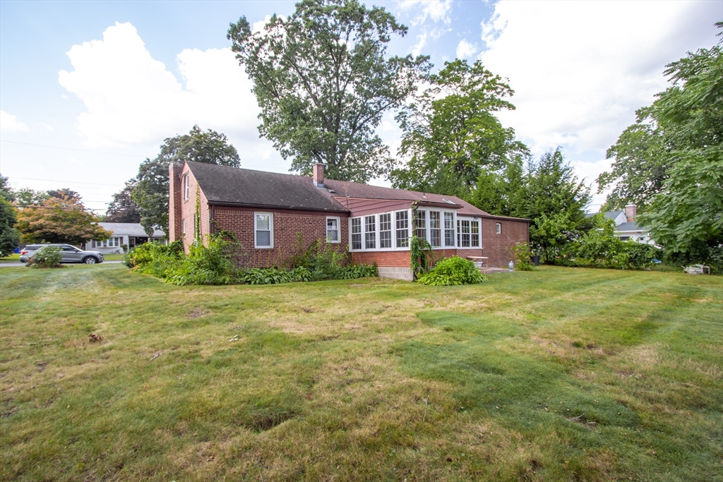 267 Winton Street Springfield, MA 01118 - Photo 27 of 28 a front view of a house with a garden