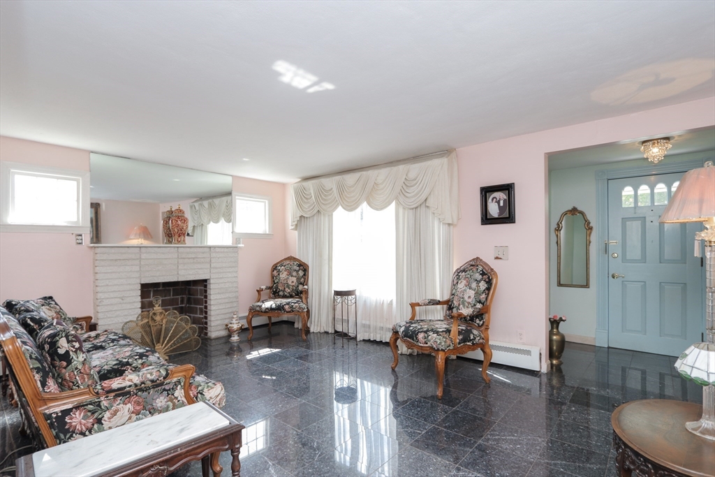 267 Winton Street Springfield, MA 01118 - Photo 4 of 28 a living room with furniture and a fireplace