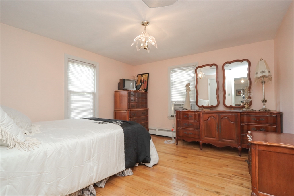 267 Winton Street Springfield, MA 01118 - Photo 7 of 28 a bedroom with a bed and a dresser