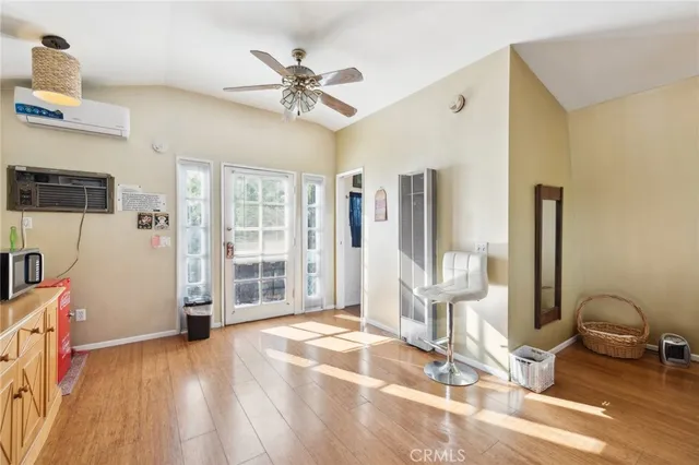 a view of a livingroom with furniture and windows