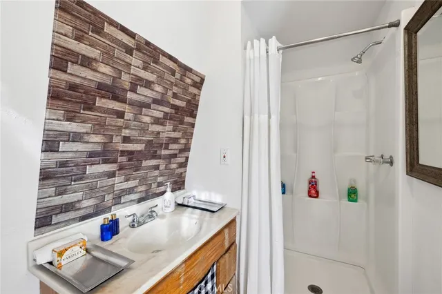 a view of a yard with plants and trees