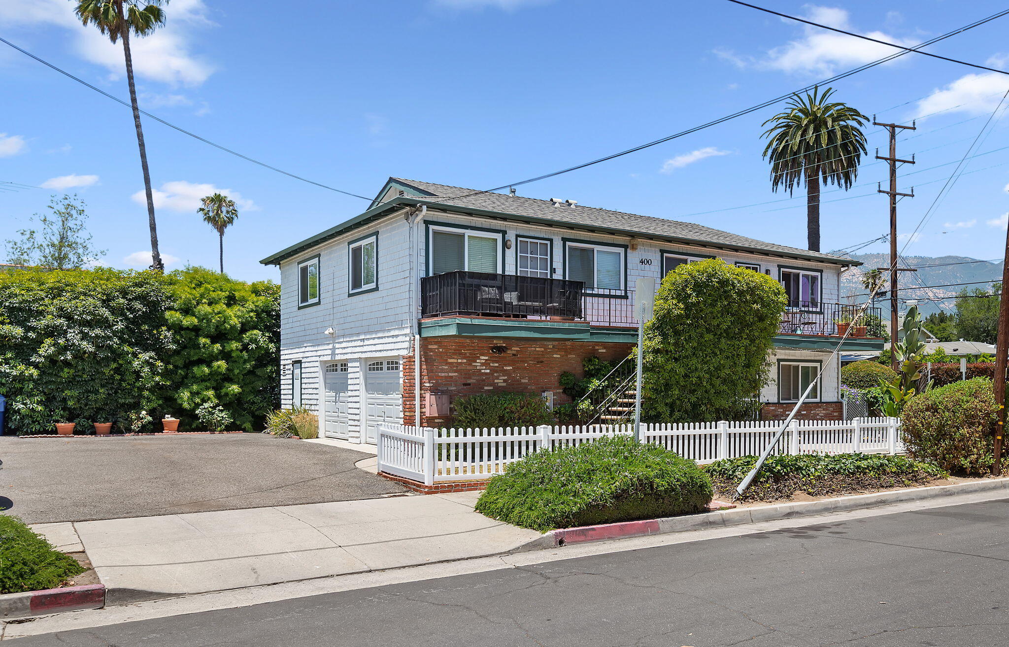 400 West Pedregosa Street Santa Barbara, CA 93101 - Photo 1 of 41 a front view of a house with a garden and plants