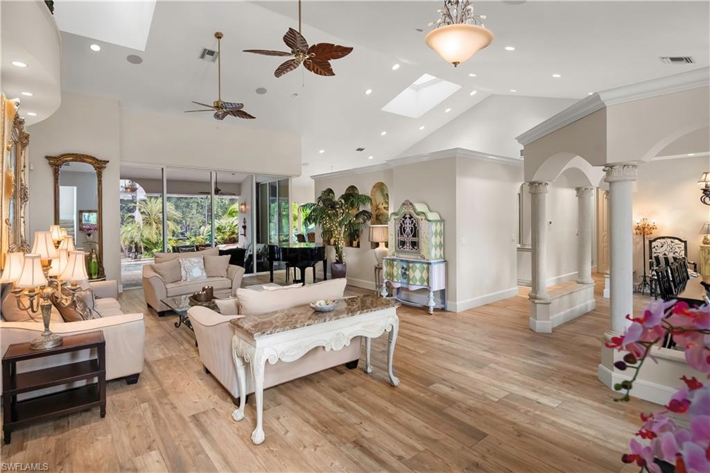 649 Bow Line Drive Naples, FL 34103 - Photo 4 of 31 a living room with furniture and a chandelier