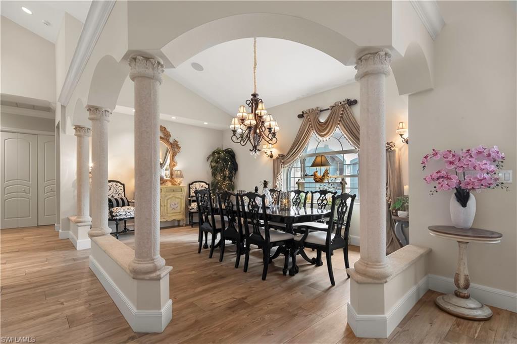 649 Bow Line Drive Naples, FL 34103 - Photo 8 of 31 a view of a dining room with furniture window and wooden floor