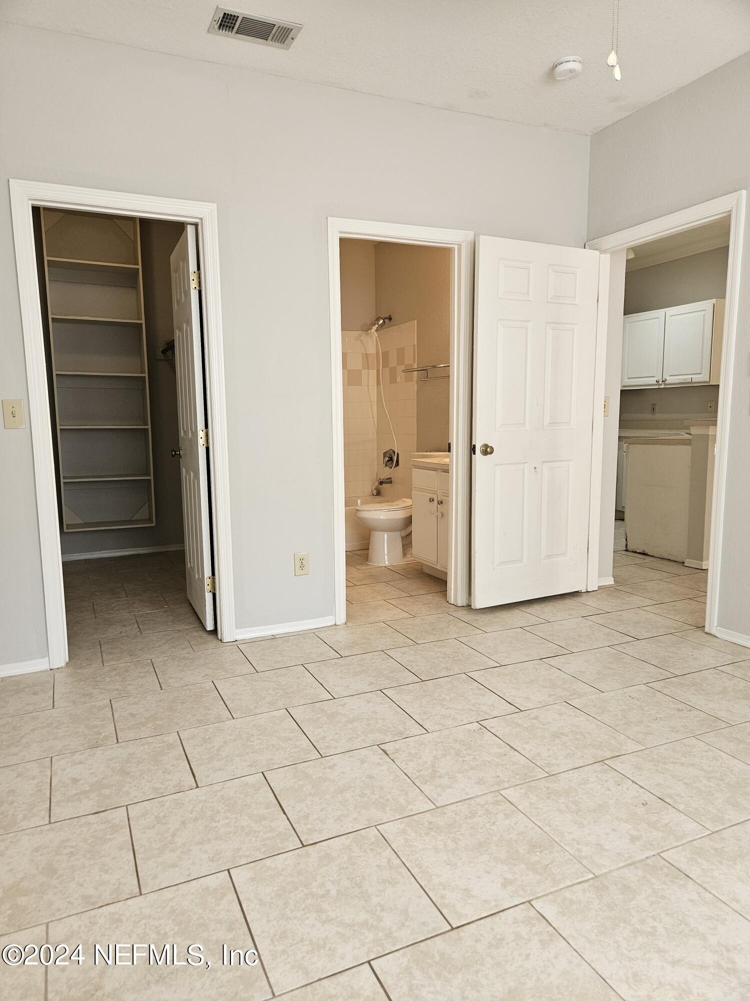 13810 Sutton Park Drive North, Unit 916 Jacksonville, FL 32224 - Photo 12 of 17 a view of an empty room and closet area