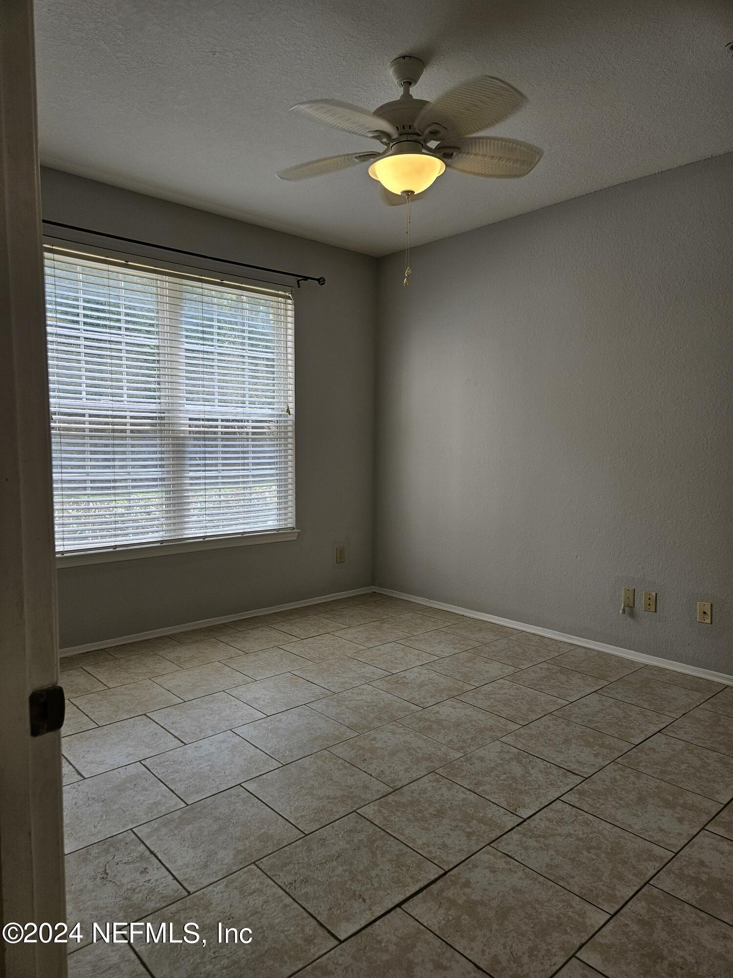 13810 Sutton Park Drive North, Unit 916 Jacksonville, FL 32224 - Photo 13 of 17 an empty room with a empty space and a window