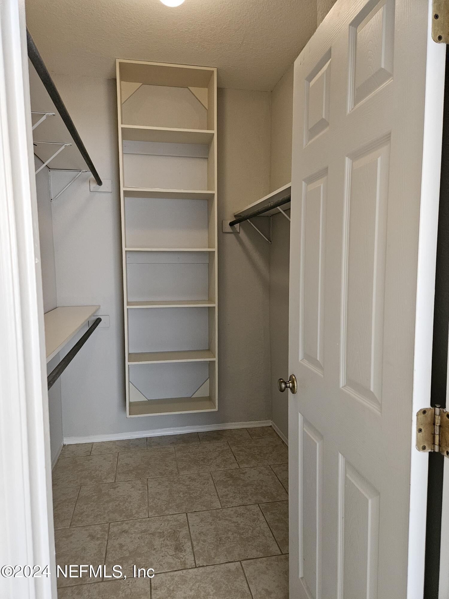 13810 Sutton Park Drive North, Unit 916 Jacksonville, FL 32224 - Photo 14 of 17 a view of an empty walk in closet