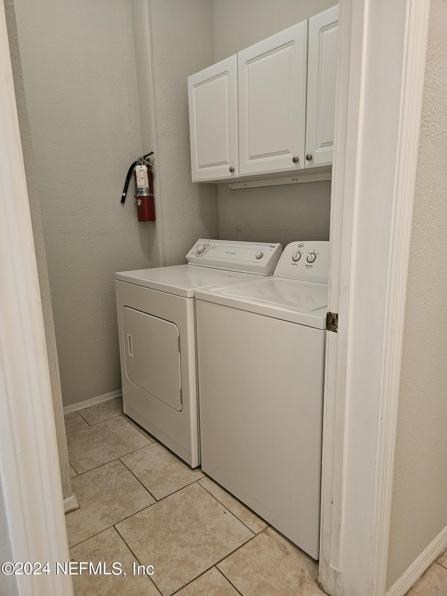 13810 Sutton Park Drive North, Unit 916 Jacksonville, FL 32224 - Photo 16 of 17 a utility room with dryer and washer
