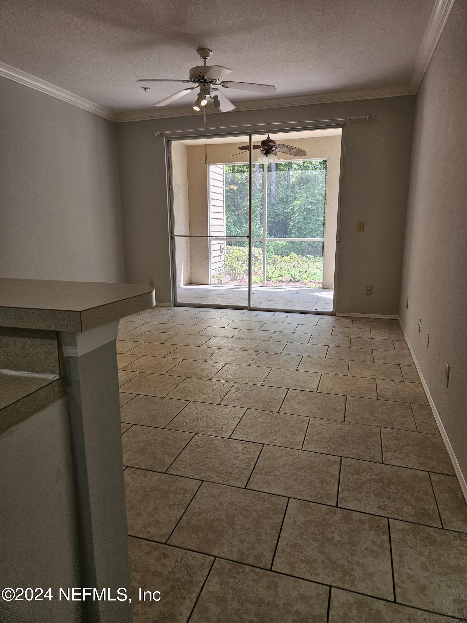 13810 Sutton Park Drive North, Unit 916 Jacksonville, FL 32224 - Photo 4 of 17 a view of an empty room with a window