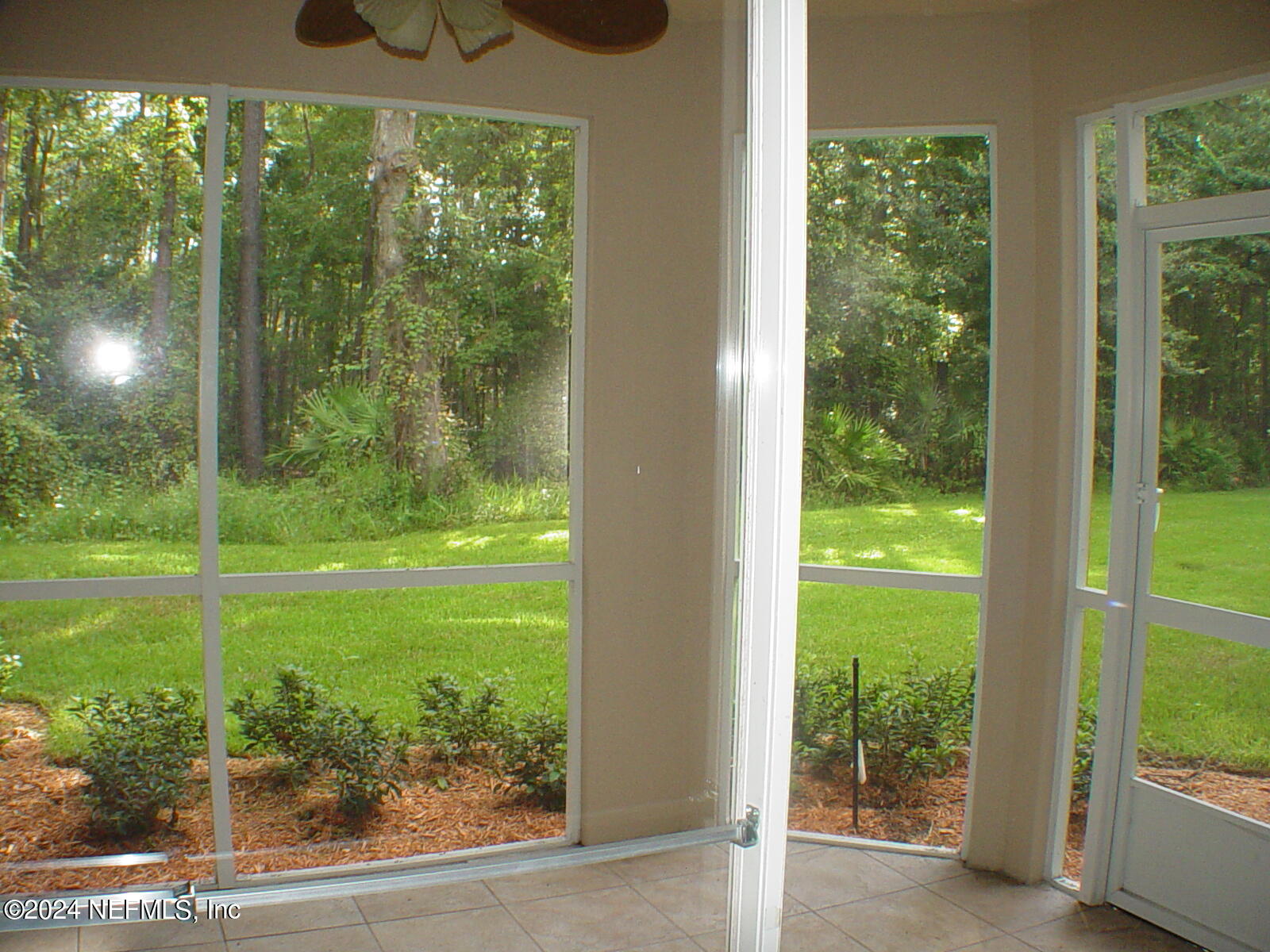 13810 Sutton Park Drive North, Unit 916 Jacksonville, FL 32224 - Photo 6 of 17 a view of a glass door and a yard from a window