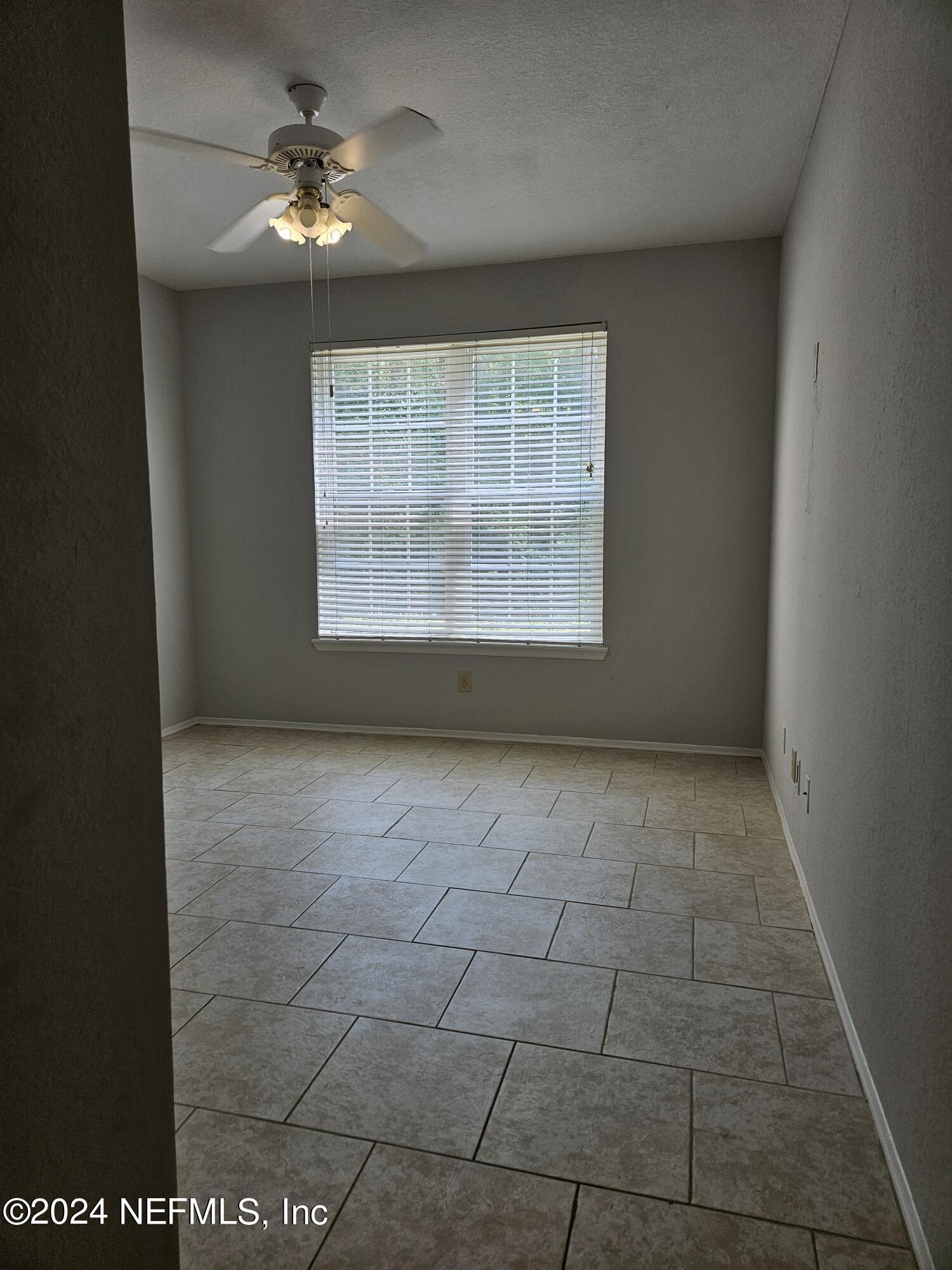 13810 Sutton Park Drive North, Unit 916 Jacksonville, FL 32224 - Photo 9 of 17 a view of an empty room with a window