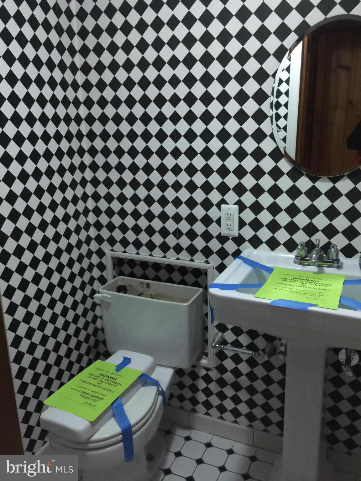 104 Croydon Road Baltimore, MD 21212 - Photo 12 of 13 a room with a black and white wall