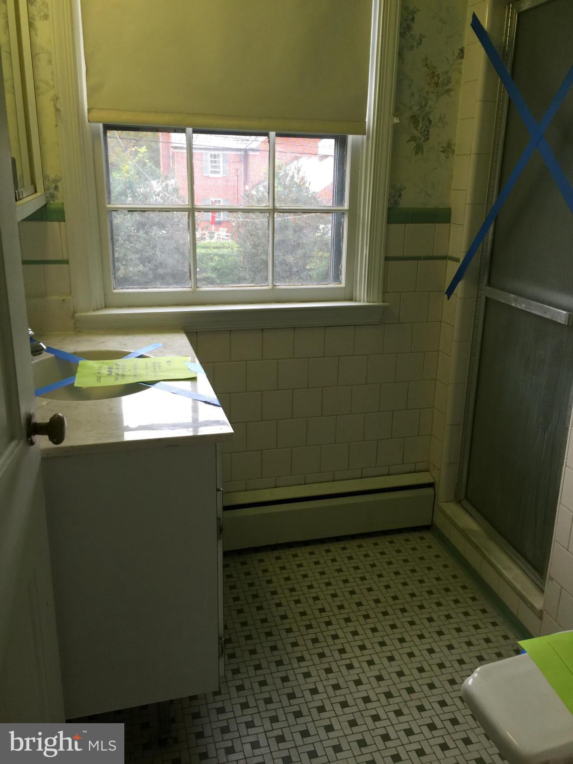104 Croydon Road Baltimore, MD 21212 - Photo 13 of 13 a bathroom with a toilet and a shower