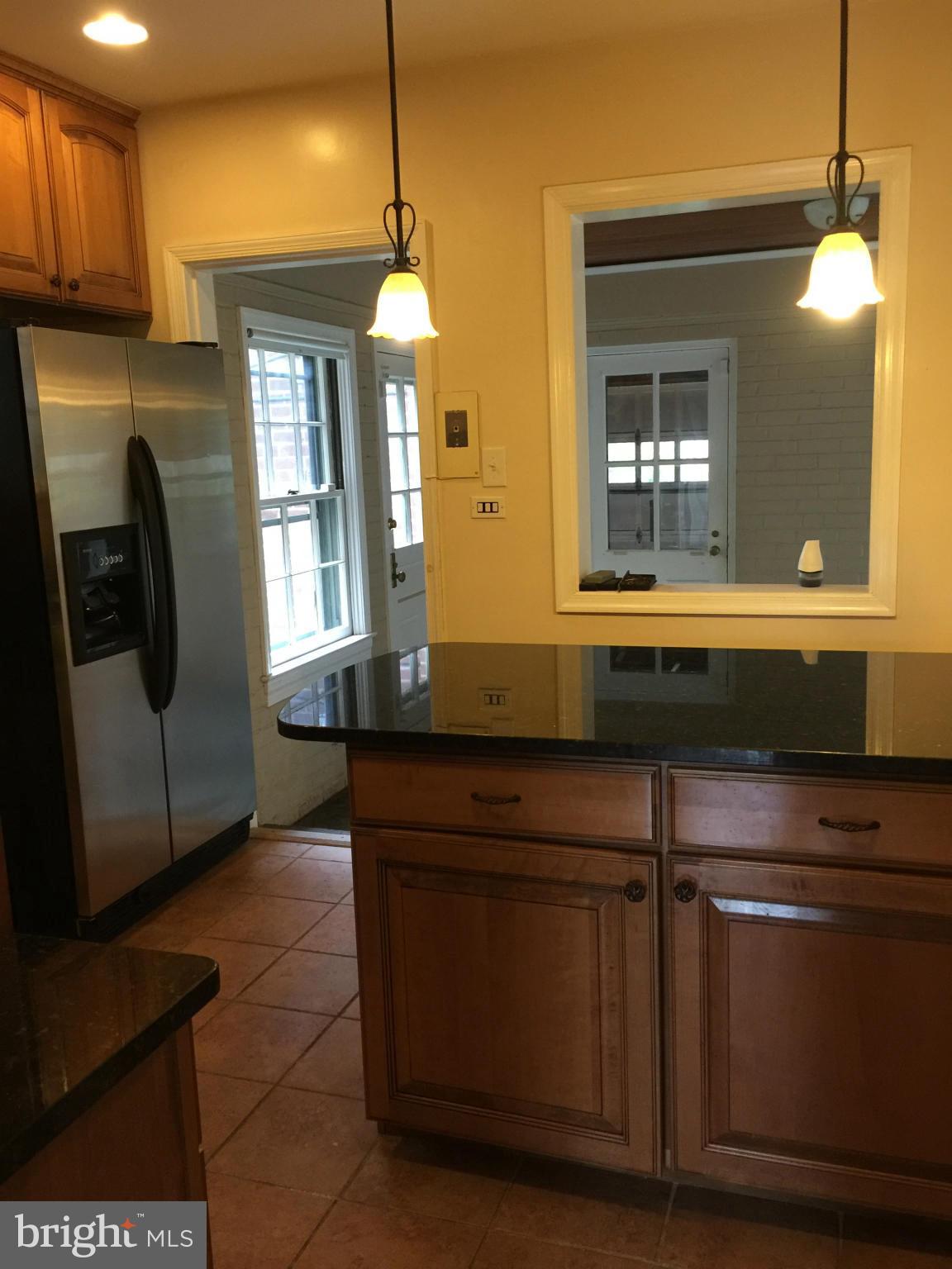 104 Croydon Road Baltimore, MD 21212 - Photo 3 of 13 a kitchen with a sink a counter space and a window