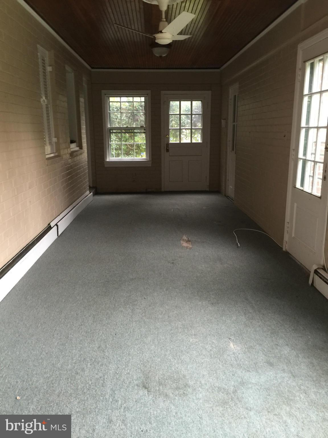 104 Croydon Road Baltimore, MD 21212 - Photo 4 of 13 an empty room with windows