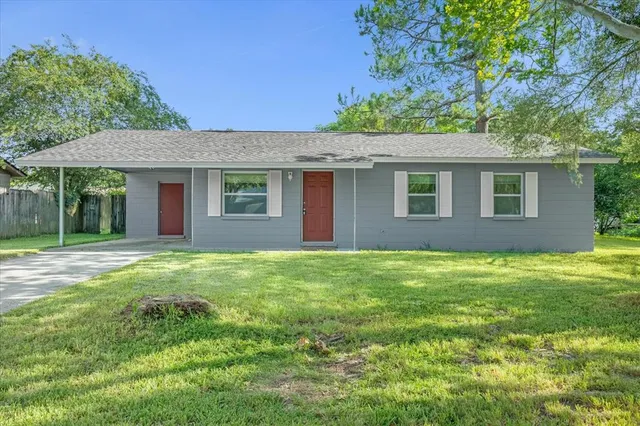 front view of a house with a yard