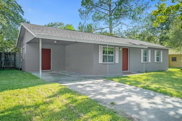 a backyard of a house with seating space