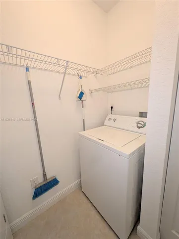 a bathroom with a tub a sink and a shower
