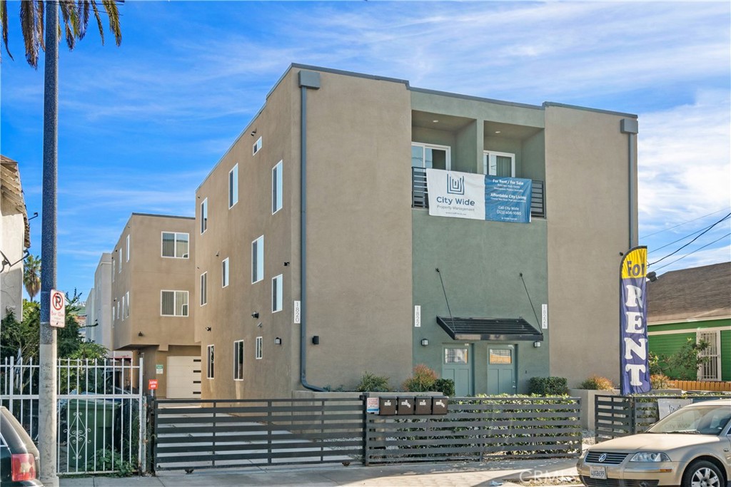 1822 Orchard Avenue, Unit 1822 Los Angeles, CA 90006 - Photo 1 of 17 a front view of a house with a yard