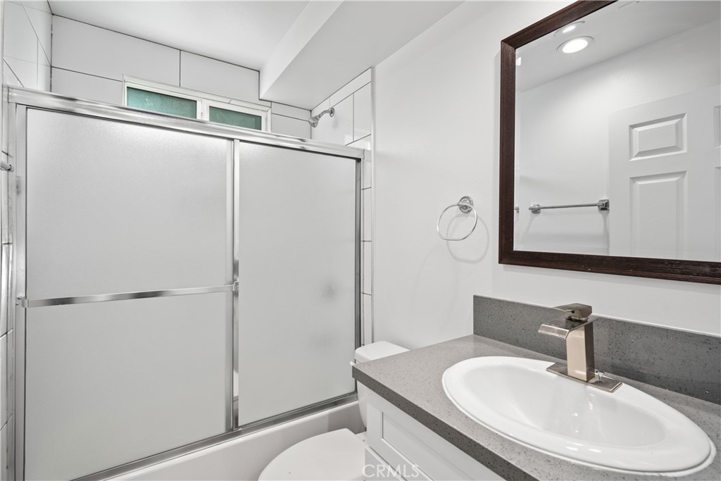 1822 Orchard Avenue, Unit 1822 Los Angeles, CA 90006 - Photo 12 of 17 a bathroom with a sink toilet and shower