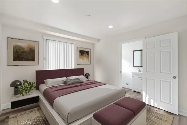 a bedroom with a bed and a couch