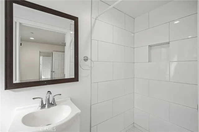 a bathroom with a sink and a mirror