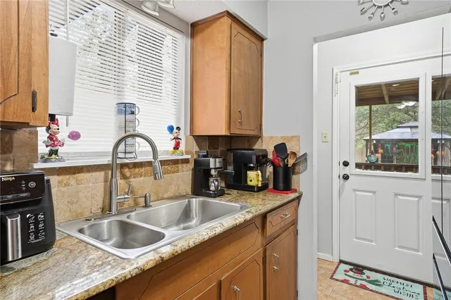 a kitchen with a sink and a window
