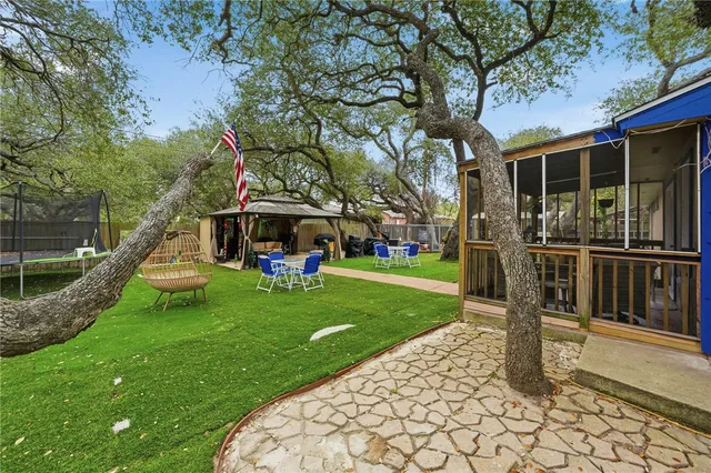 a front view of a house with a yard table and chairs