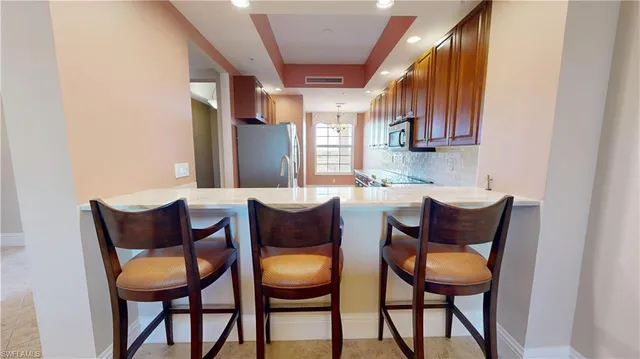 a outdoor dining space with furniture and outdoor view