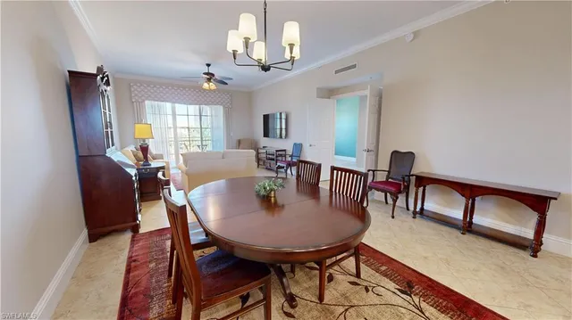 a view of a a dining room with furniture window and wooden floor
