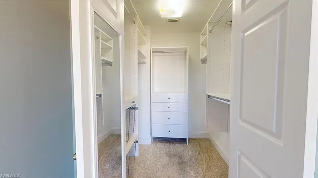 a bathroom with a sink double vanity and a mirror