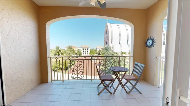 a view of a chairs and table in a balcony