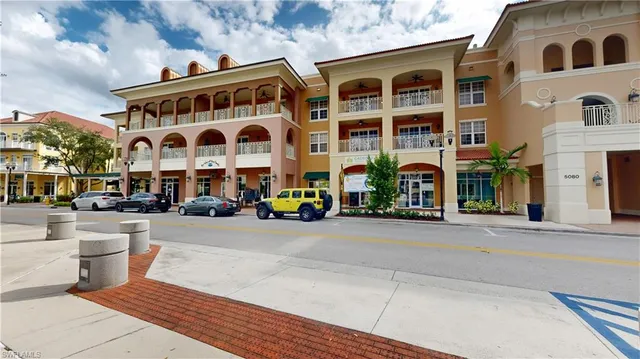 a row of palm trees and swimming pool in the backyard of a house