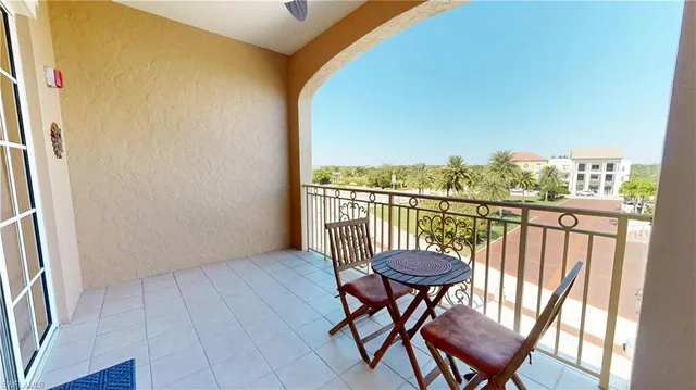 a view of a balcony with chairs